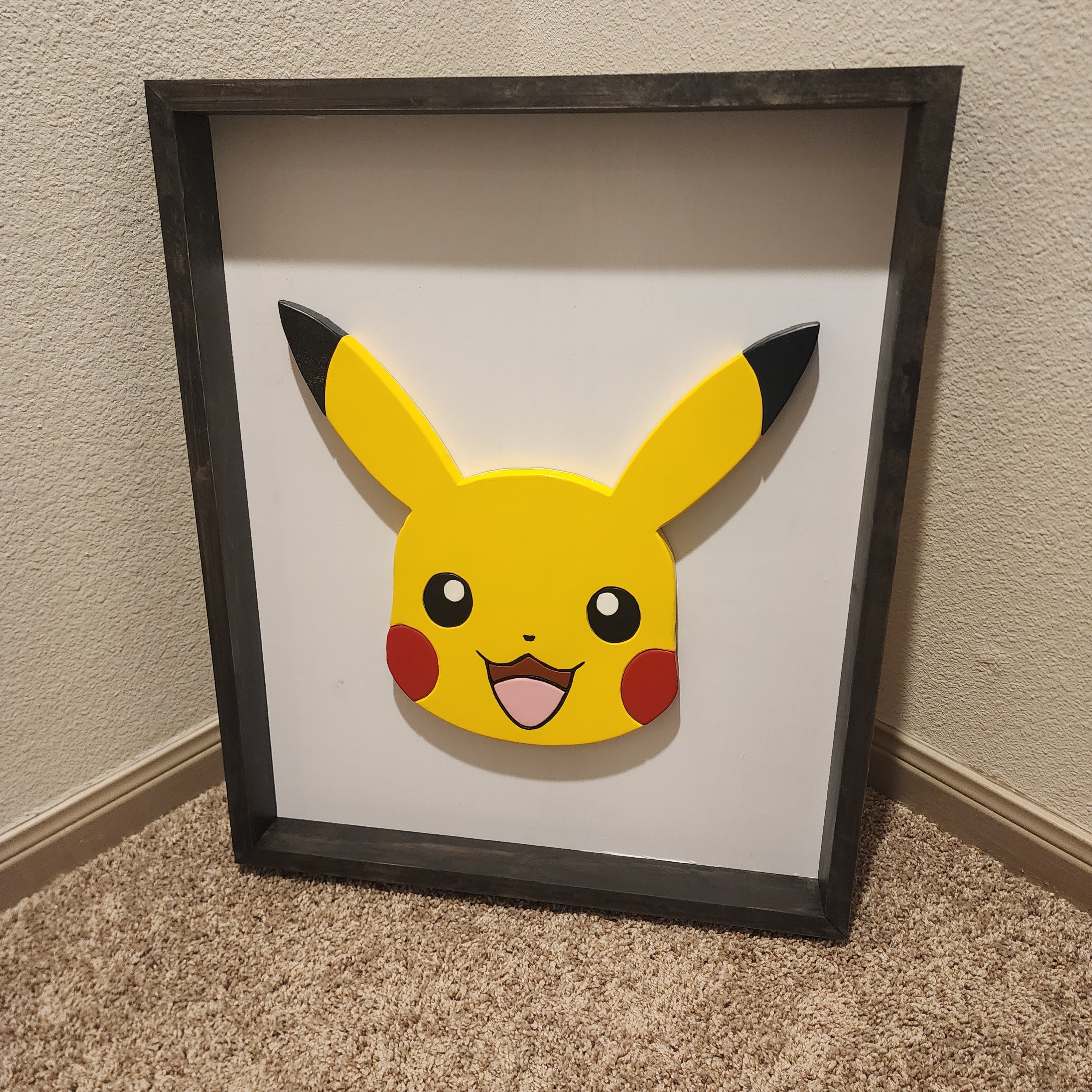 Scroll Saw Pikachu wall art. This wall art measures 20.5" x 25" x 2". Painted with acrylic paint and dark jacobean finish.