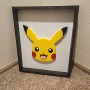 Scroll Saw Pikachu wall art. This wall art measures 20.5" x 25" x 2". Painted with acrylic paint and dark jacobean finish.