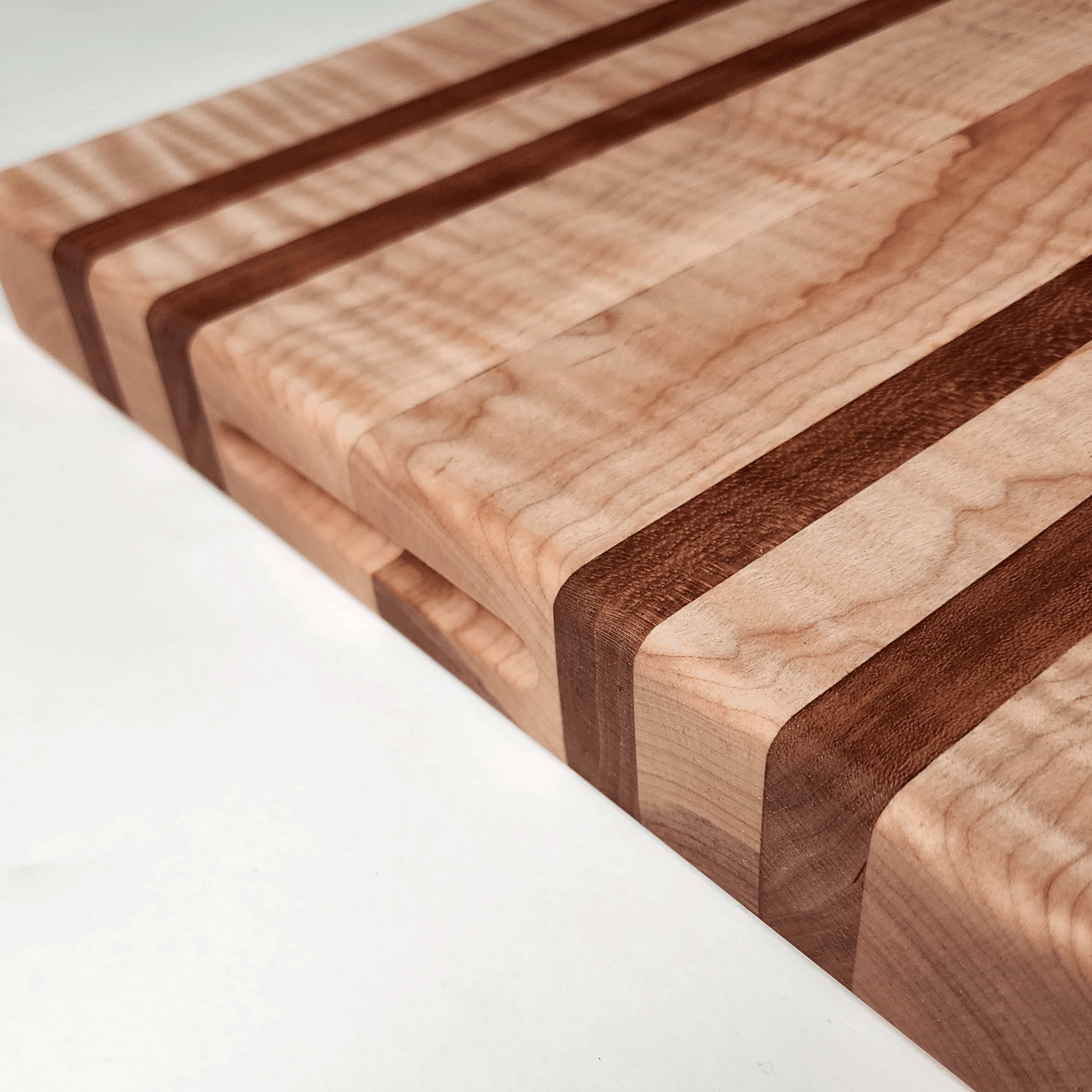 Cherry and Maple Cutting board with side finger grip