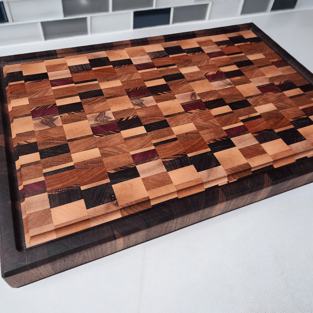 Mixed wood chaos style end grain board with walnut border and juice groove