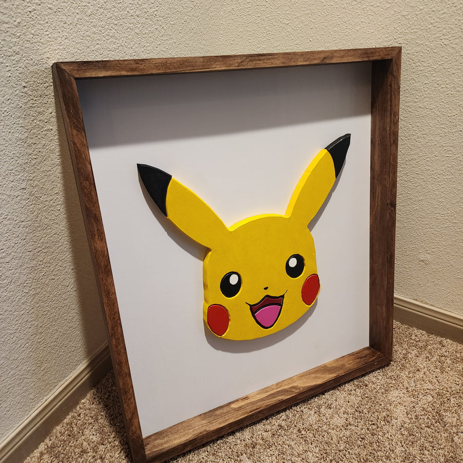 Pikachu scroll saw art with spray paint finish. Frame is mahogany stained. 20.5" x 25" x 2"