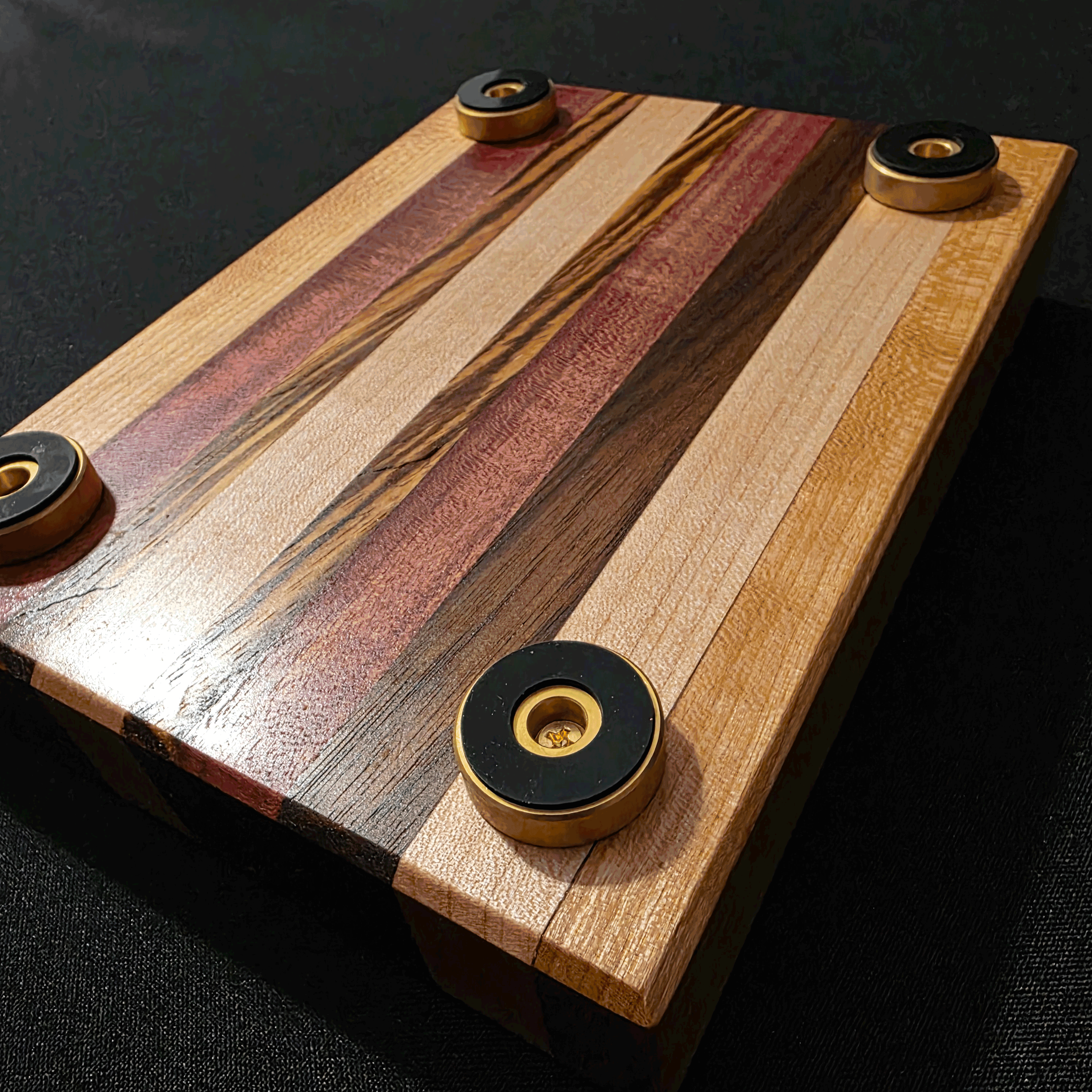 Bottom of mixed exotic wood cigar tray showing non slip brass feet