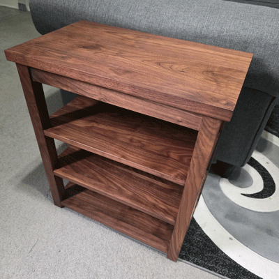 Custom solid walnut table with three shelves made by zero six designs
